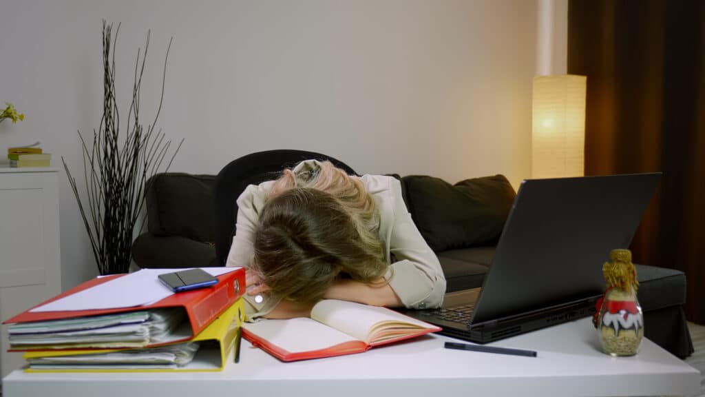 Business woman sleeps on desk 2115612