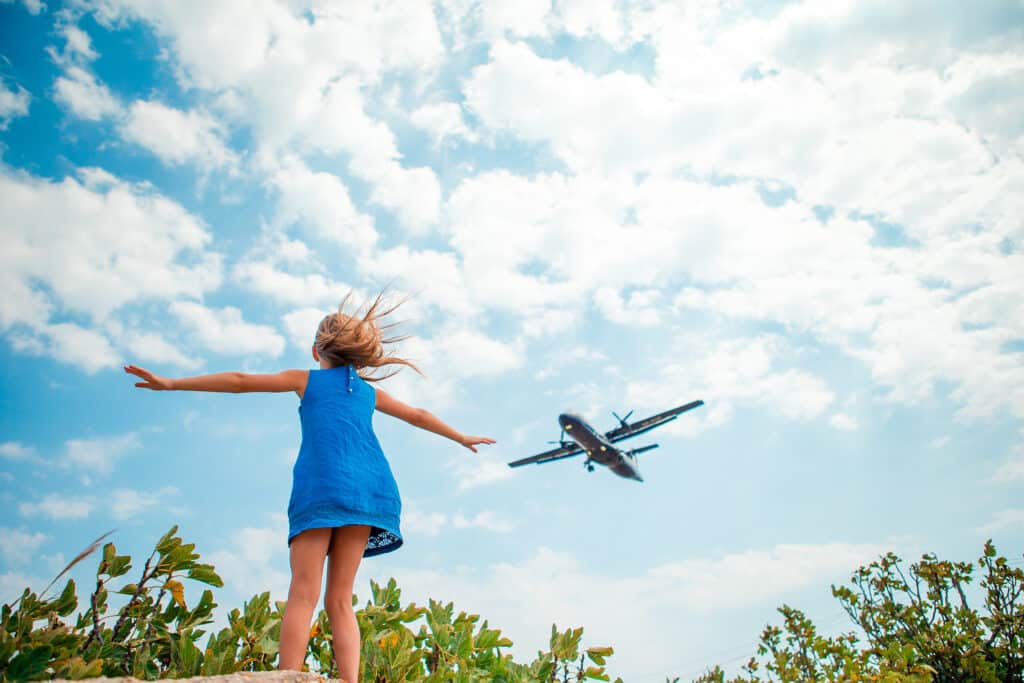 Girl looking at an airplane 422214