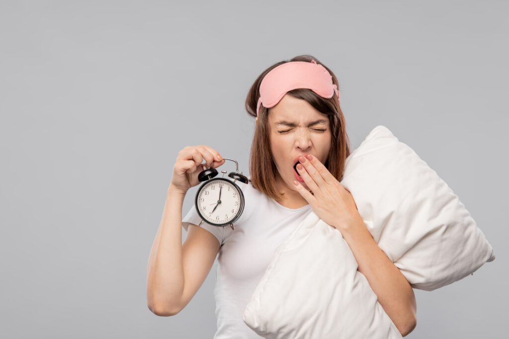 Sleepy young woman with pillow and 445835