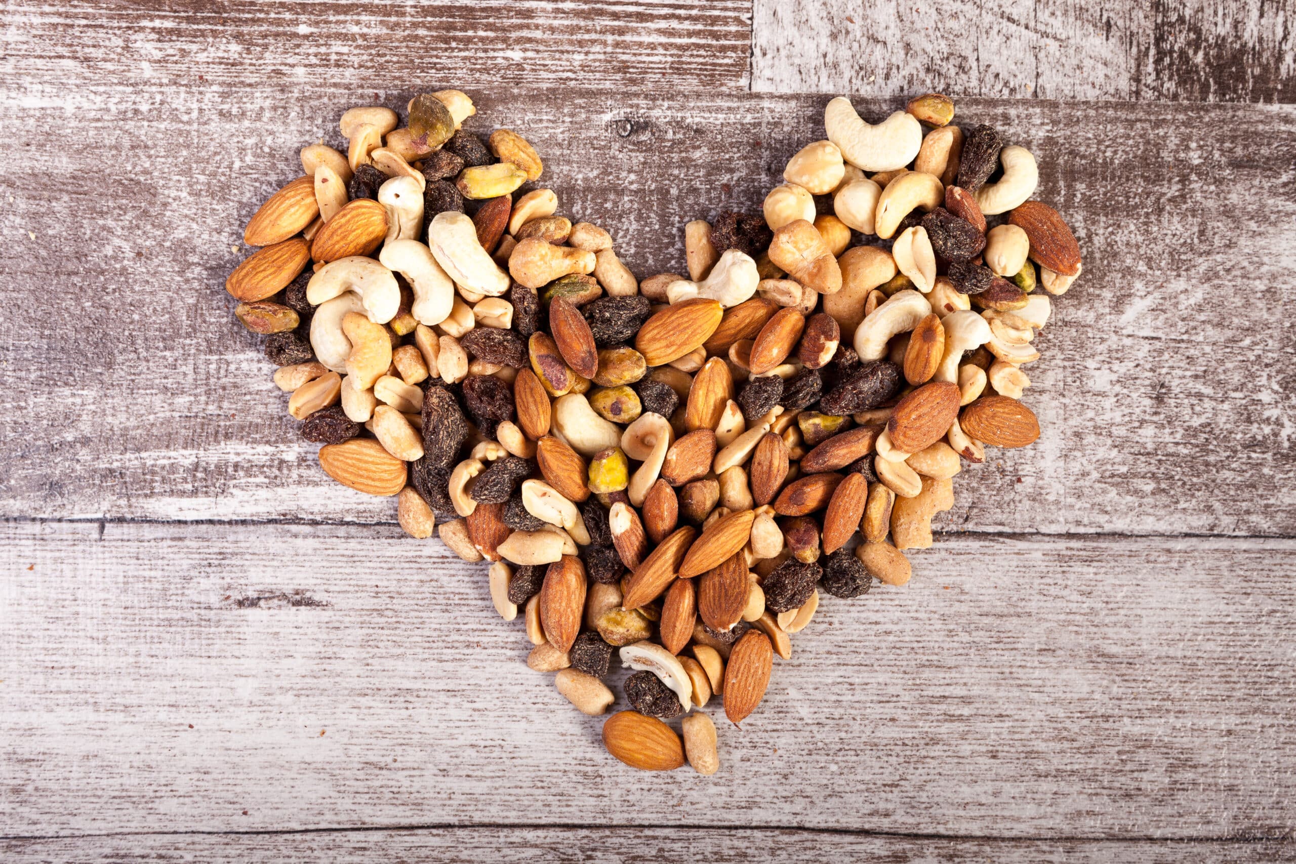 Mix of healthy raw nuts in heart shape 347633 scaled