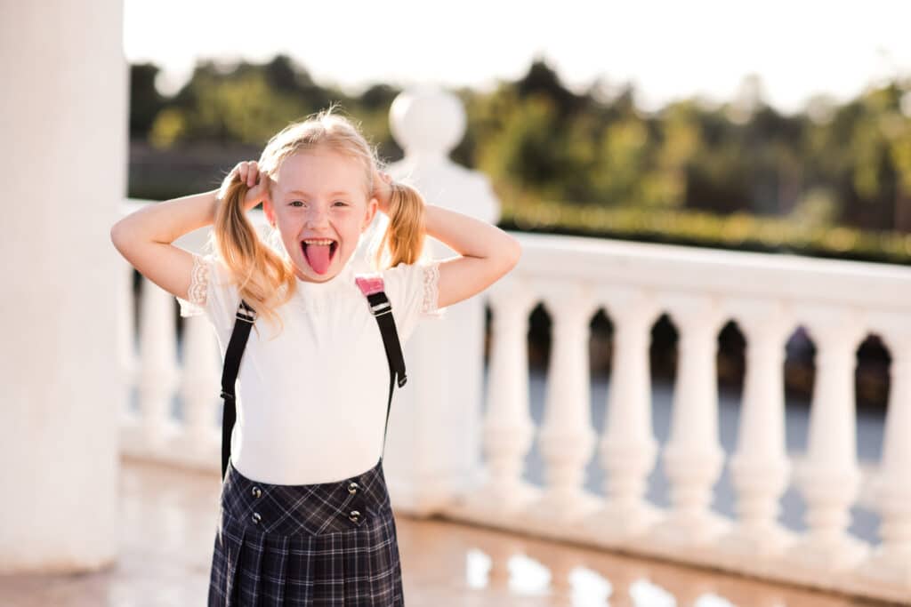 Smiling girl with a backpack 1750364