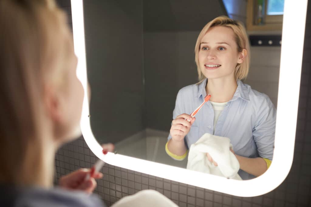 Woman brushing teeth 399975