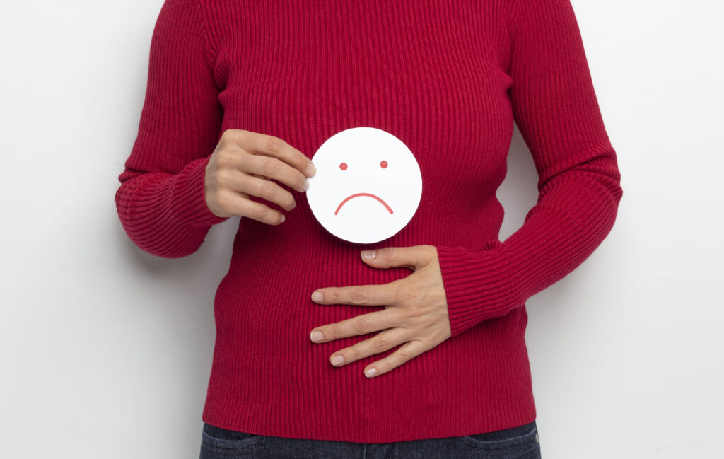 Woman holding sad emoji 1057552 1